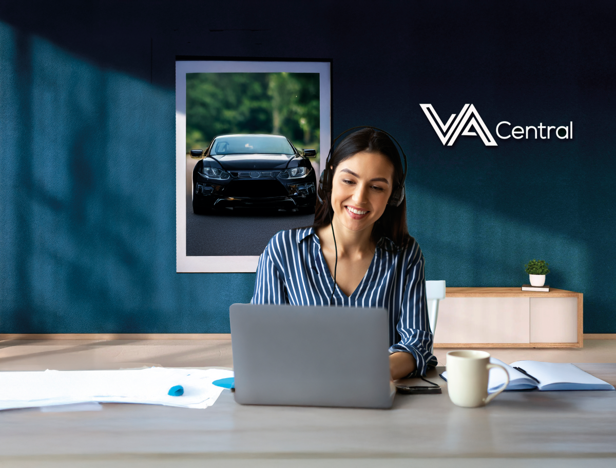 Smiling woman working on laptop while sitting at a desk.